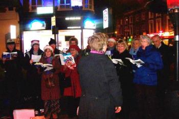 Carol singing outside the Dignity